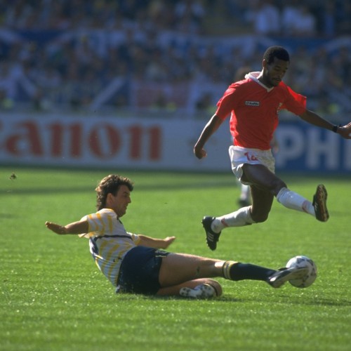 Dave McPherson of Scotland kicks the ball away as J Cayass of Costa Rica leaps over it